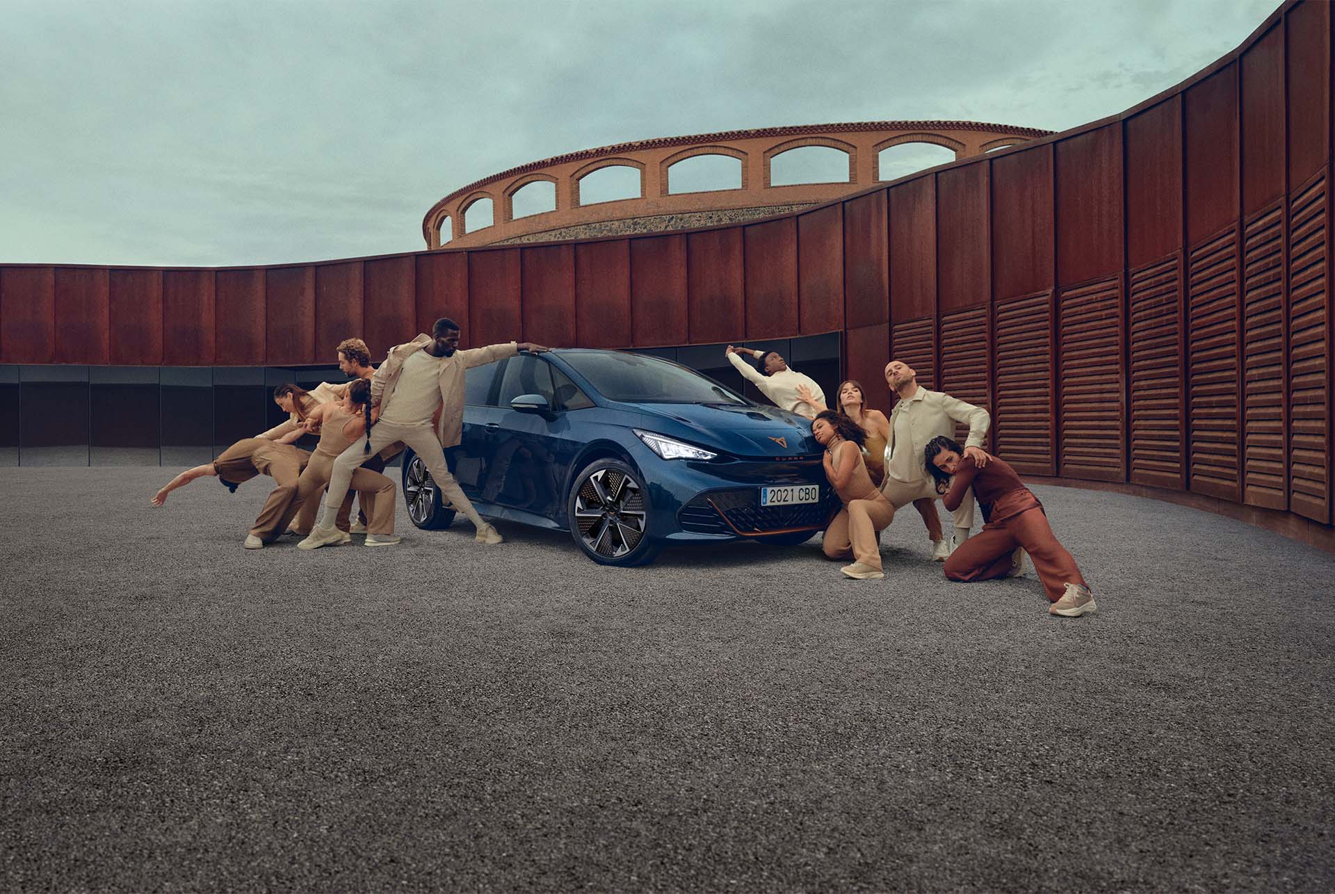 People posing around the CUPRA Born Aurora Blue colour