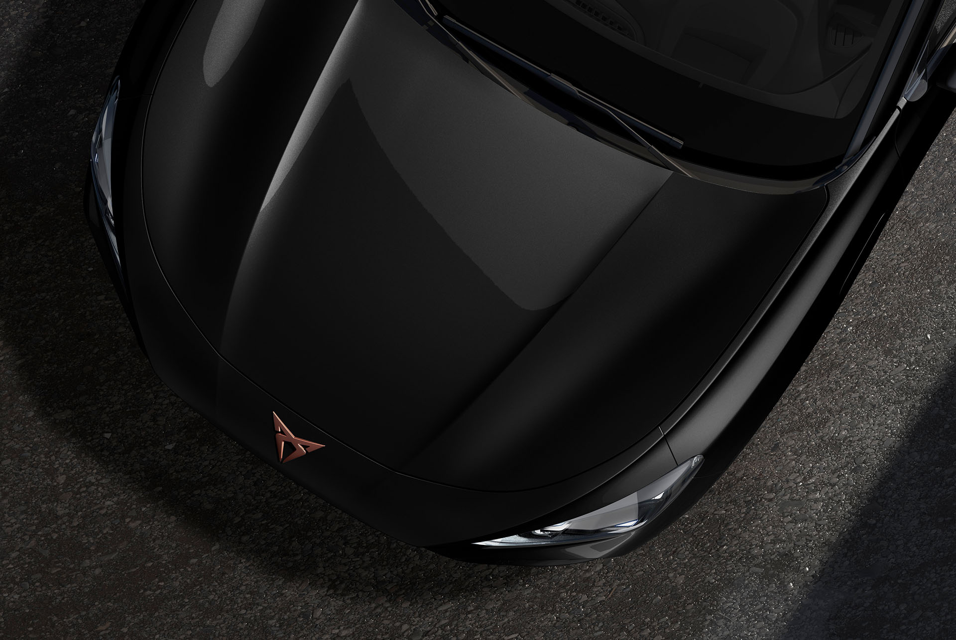 Cupra terramar, midnight black colour, top-down view of the front hood and headlights.